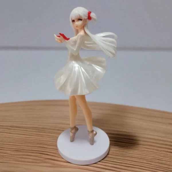 24 cm tall resin ballerina figure wearing a white dress and holding a red ribbon, posed gracefully